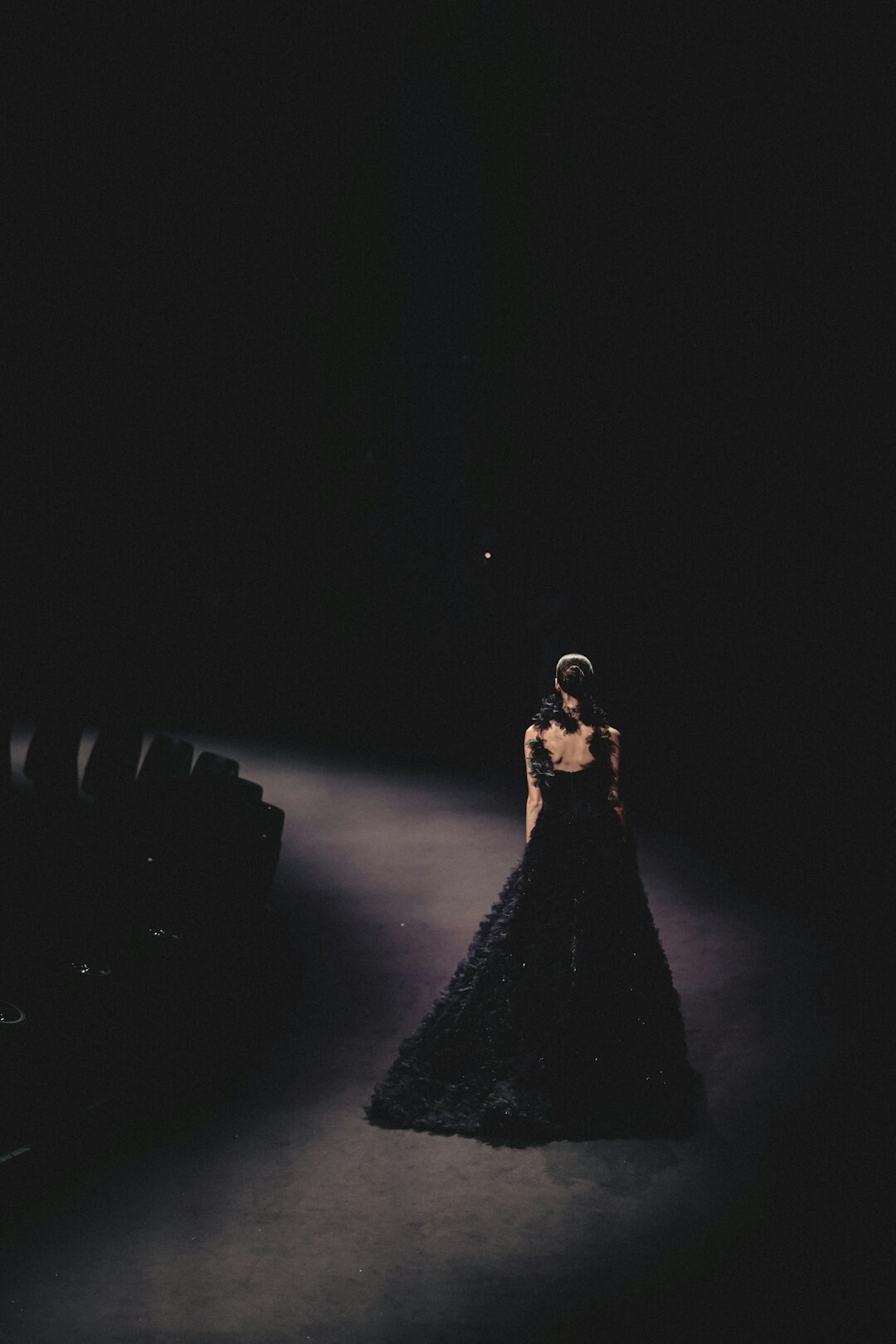 Fashion runway show with dramatic stage lighting