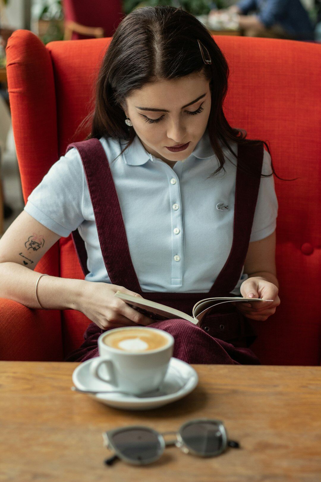 woman reading script in cafe