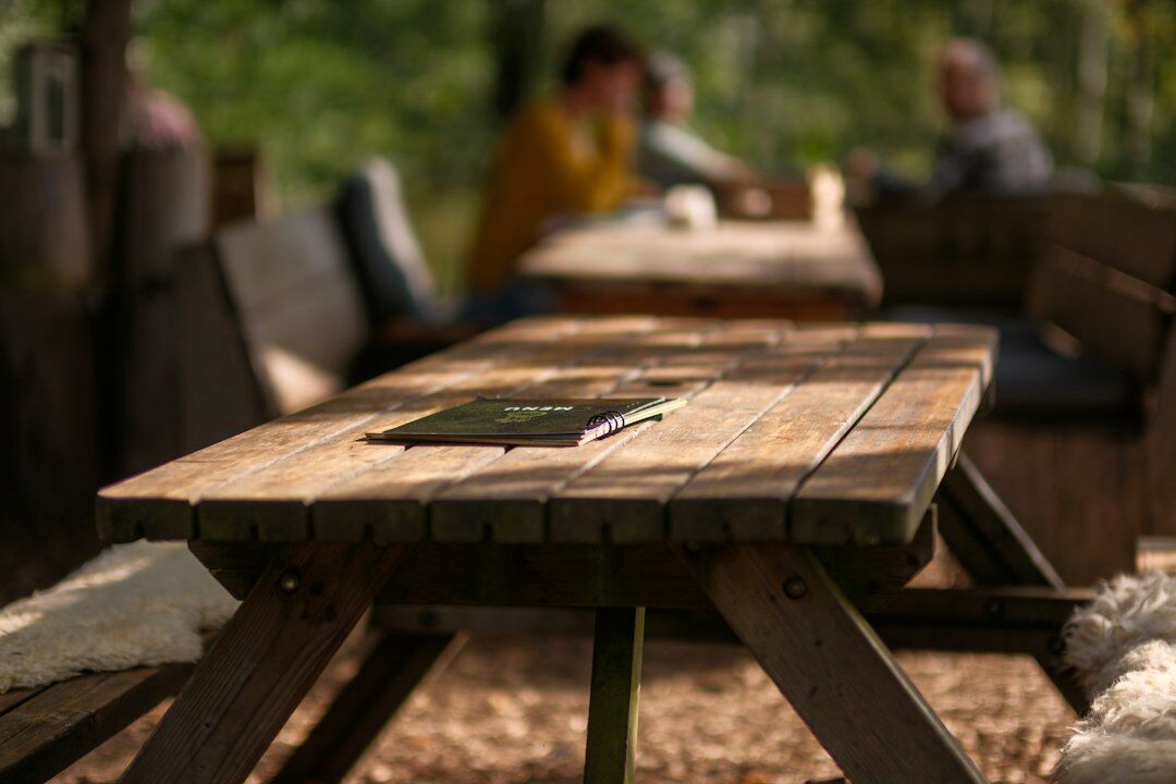 Editorial team reviewing layouts at a wooden table